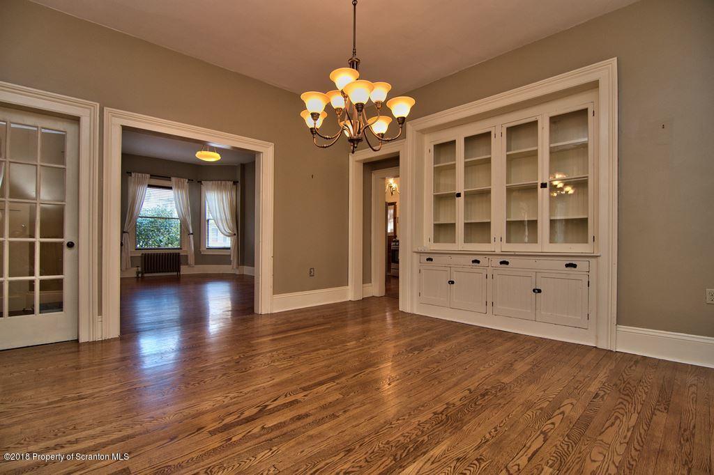 754 Green Ridge Street Scranton, PA 18509 - Photo 33 of 77 a view of an empty room with wooden floor and a large window