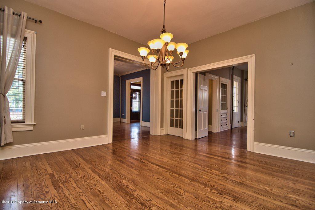 754 Green Ridge Street Scranton, PA 18509 - Photo 34 of 77 a view of an empty room with wooden floor and a window