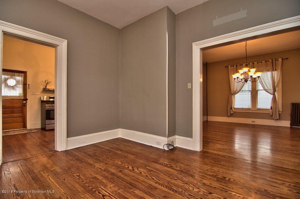 754 Green Ridge Street Scranton, PA 18509 - Photo 40 of 77 an empty room with wooden floor and windows