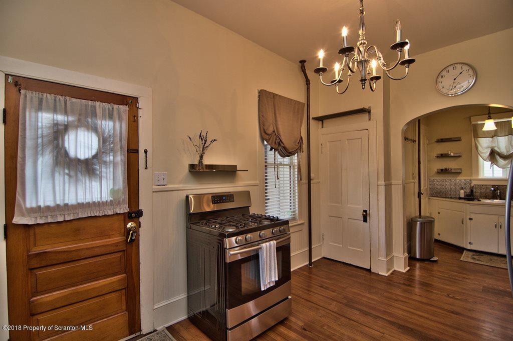 754 Green Ridge Street Scranton, PA 18509 - Photo 45 of 77 a kitchen with stainless steel appliances a stove top oven and cabinets