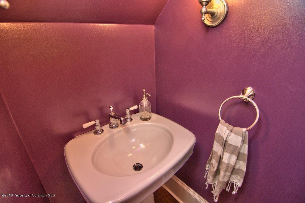 754 Green Ridge Street Scranton, PA 18509 - Photo 52 of 77 a bathroom with a sink and a mirror