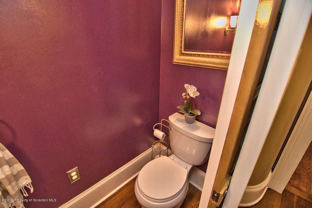 754 Green Ridge Street Scranton, PA 18509 - Photo 53 of 77 a white toilet sitting next to a small bathroom