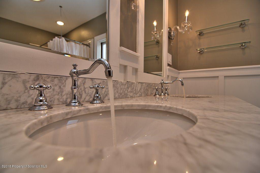 754 Green Ridge Street Scranton, PA 18509 - Photo 58 of 77 a bathroom with a sink and a mirror
