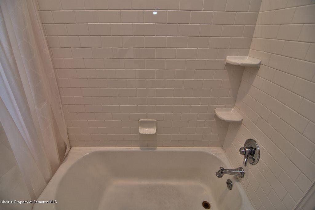 754 Green Ridge Street Scranton, PA 18509 - Photo 60 of 77 a close up of a bathtub