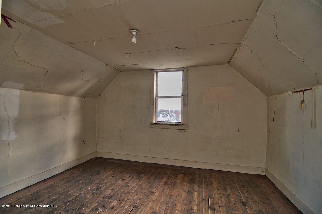 754 Green Ridge Street Scranton, PA 18509 - Photo 68 of 77 an empty room with wooden floor and windows