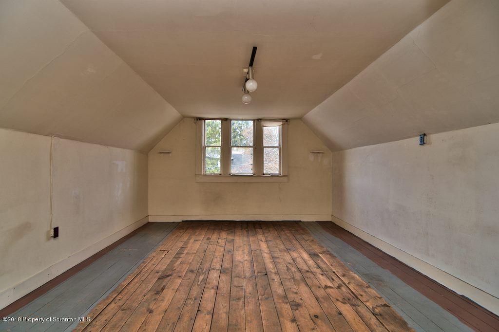 754 Green Ridge Street Scranton, PA 18509 - Photo 69 of 77 a view of empty room with wooden floor and fan