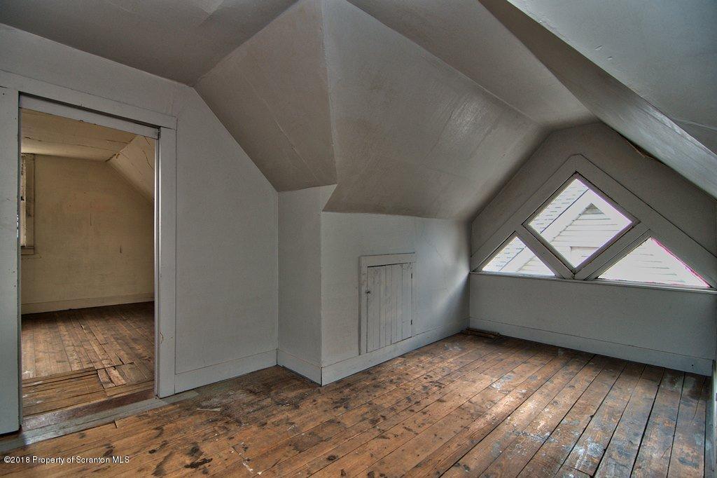 754 Green Ridge Street Scranton, PA 18509 - Photo 70 of 77 a view of empty room with wooden floor and fan
