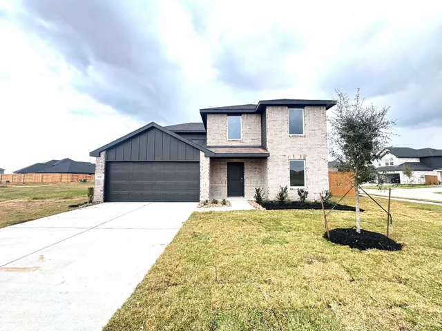a view of house with yard outdoor seating area