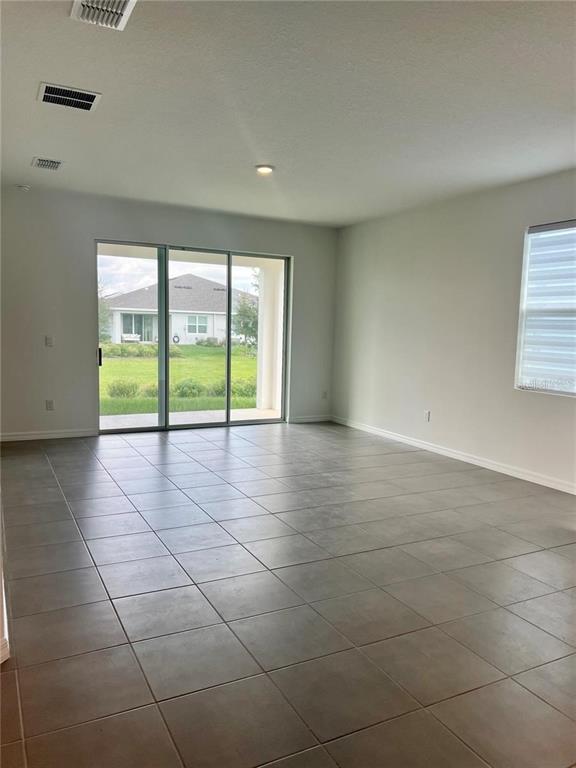 2373 Bending Bonsai Drive Wesley Chapel, FL 33543 - Photo 11 of 29 a view of an empty room with a window