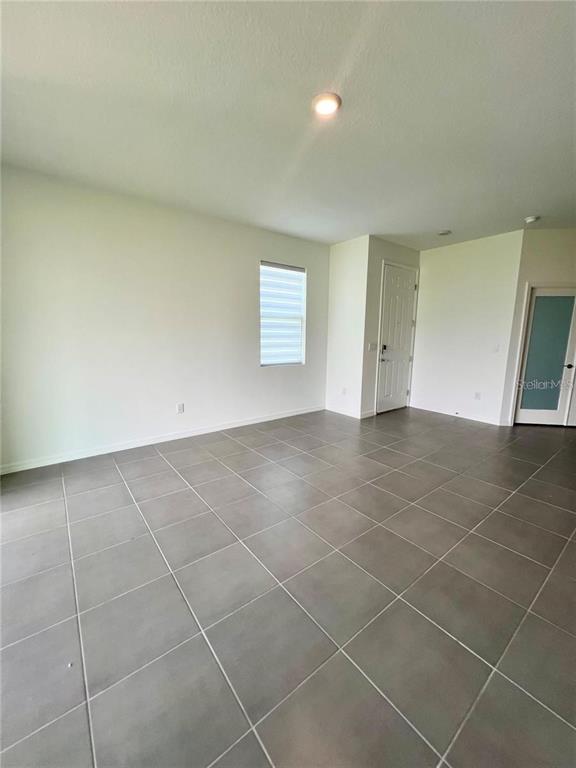 2373 Bending Bonsai Drive Wesley Chapel, FL 33543 - Photo 12 of 29 a view of an empty room with a window