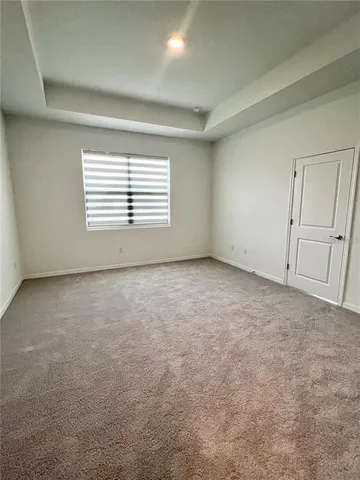 an empty room with a empty space and windows