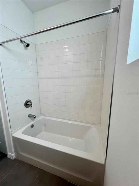 2373 Bending Bonsai Drive Wesley Chapel, FL 33543 - Photo 25 of 29 a bathroom with a bathtub and shower