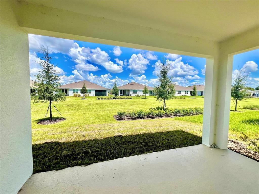 2373 Bending Bonsai Drive Wesley Chapel, FL 33543 - Photo 29 of 29 a view of a swimming pool with an outdoor space and seating area