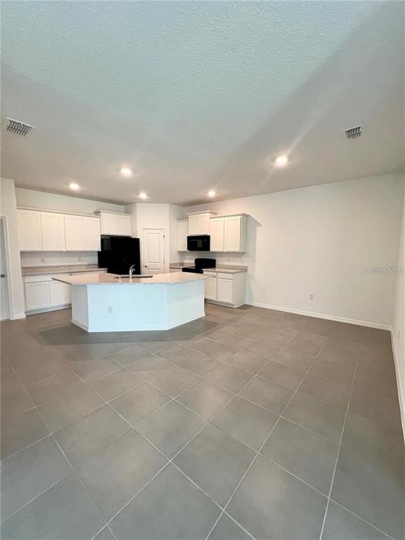 2373 Bending Bonsai Drive Wesley Chapel, FL 33543 - Photo 5 of 29 a view of kitchen with furniture and oven