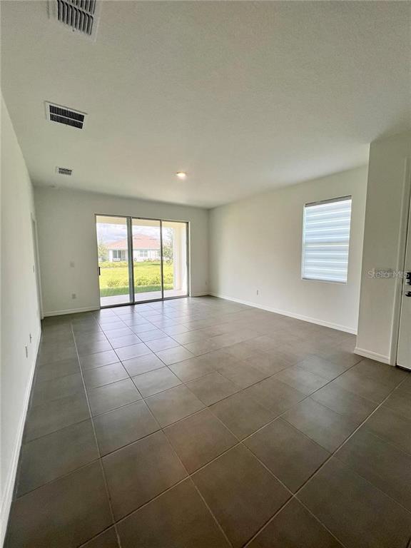 2373 Bending Bonsai Drive Wesley Chapel, FL 33543 - Photo 8 of 29 a view of an empty room with a window