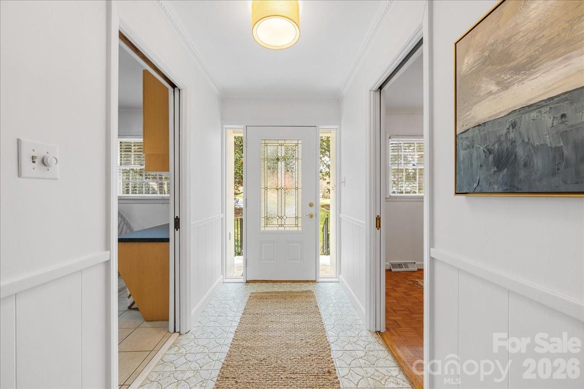 7201 Terrace Drive Charlotte, NC 28211 - Photo 3 of 48 a view of a hallway with wooden floor and a bathroom