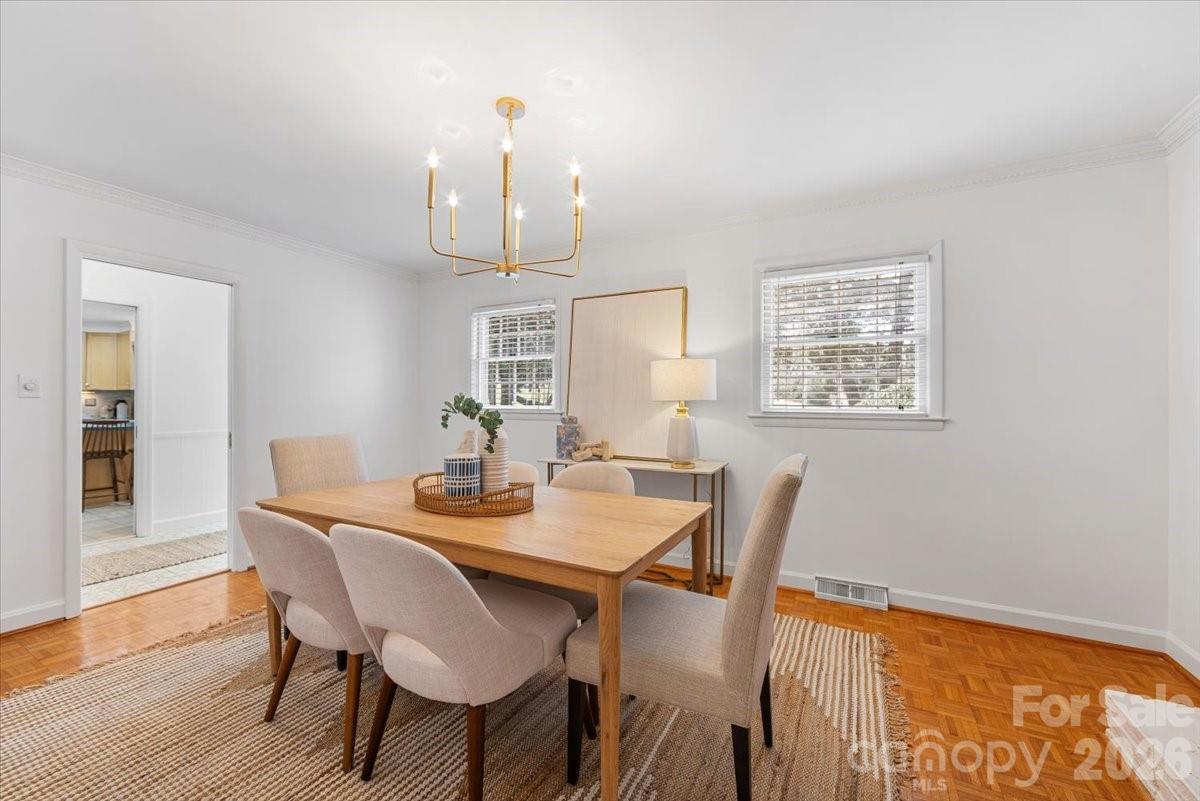 7201 Terrace Drive Charlotte, NC 28211 - Photo 10 of 48 a view of a dining room with furniture and wooden floor