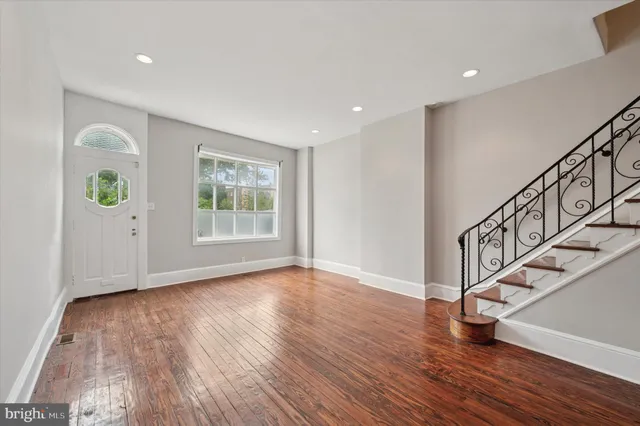 a view of an entryway with wooden floor