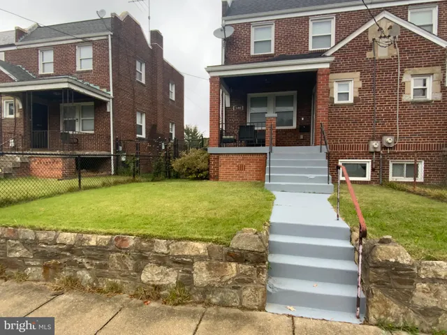 a front view of building with yard