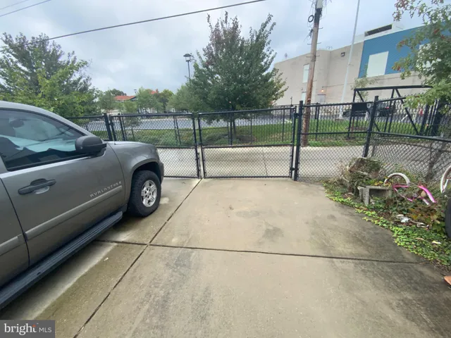 a view of a car park in front of a building