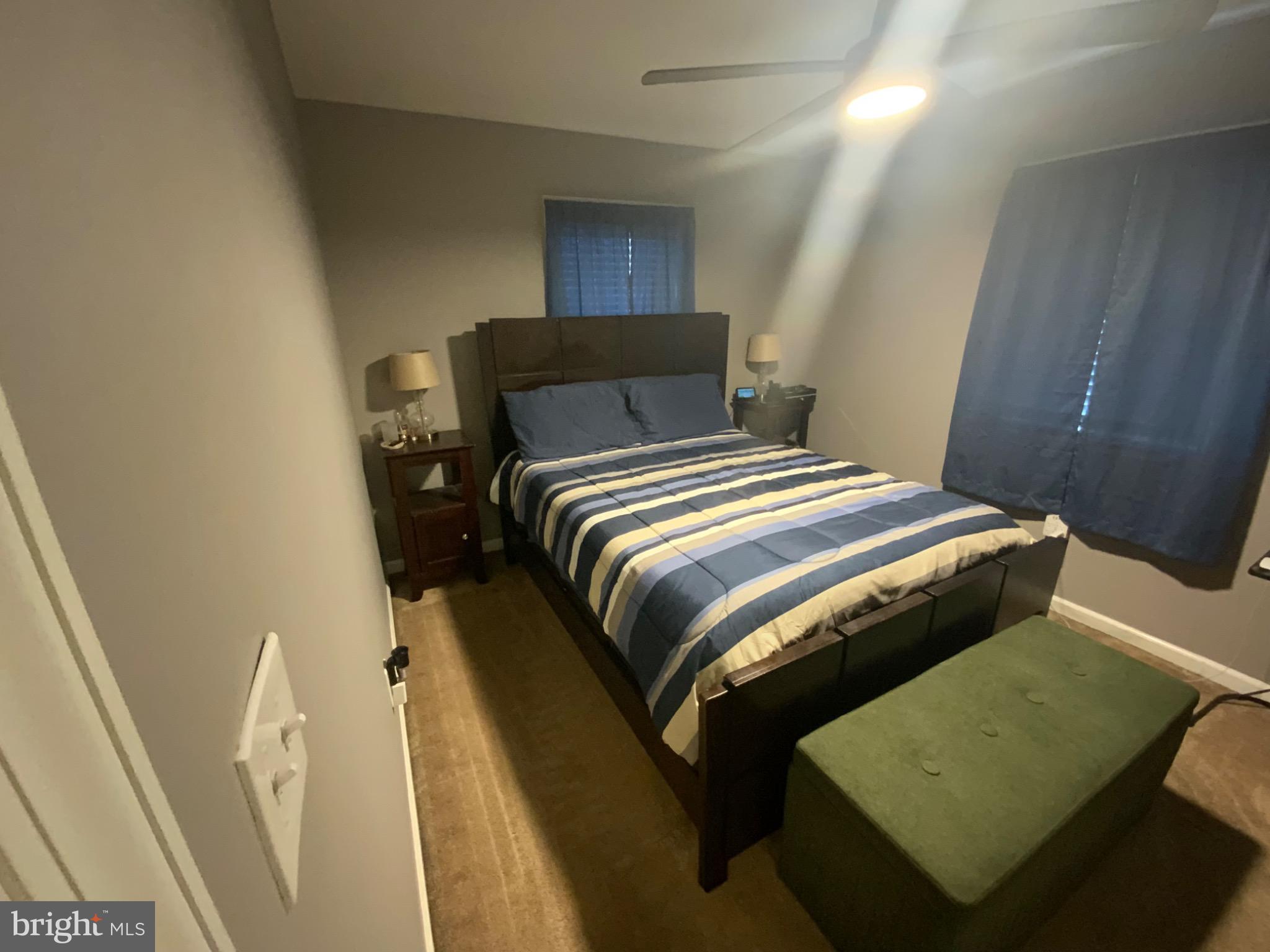 540 Lebaum Street Southeast Washington, DC 20032 - Photo 24 of 25 a bedroom with a bed and wooden floor