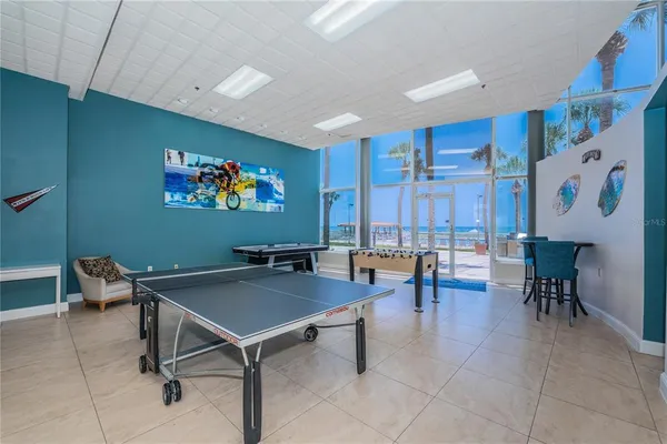 a workspace with furniture and a painting on the wall