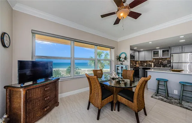 a dining room with furniture and window