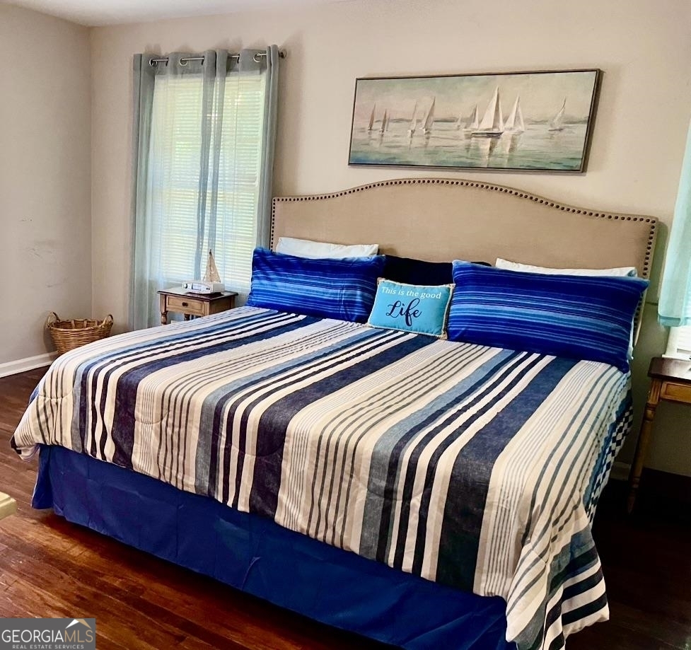 1286 Oak Hill Road Covington, GA 30016 - Photo 8 of 10 a bedroom with double bed and a painting on the wall