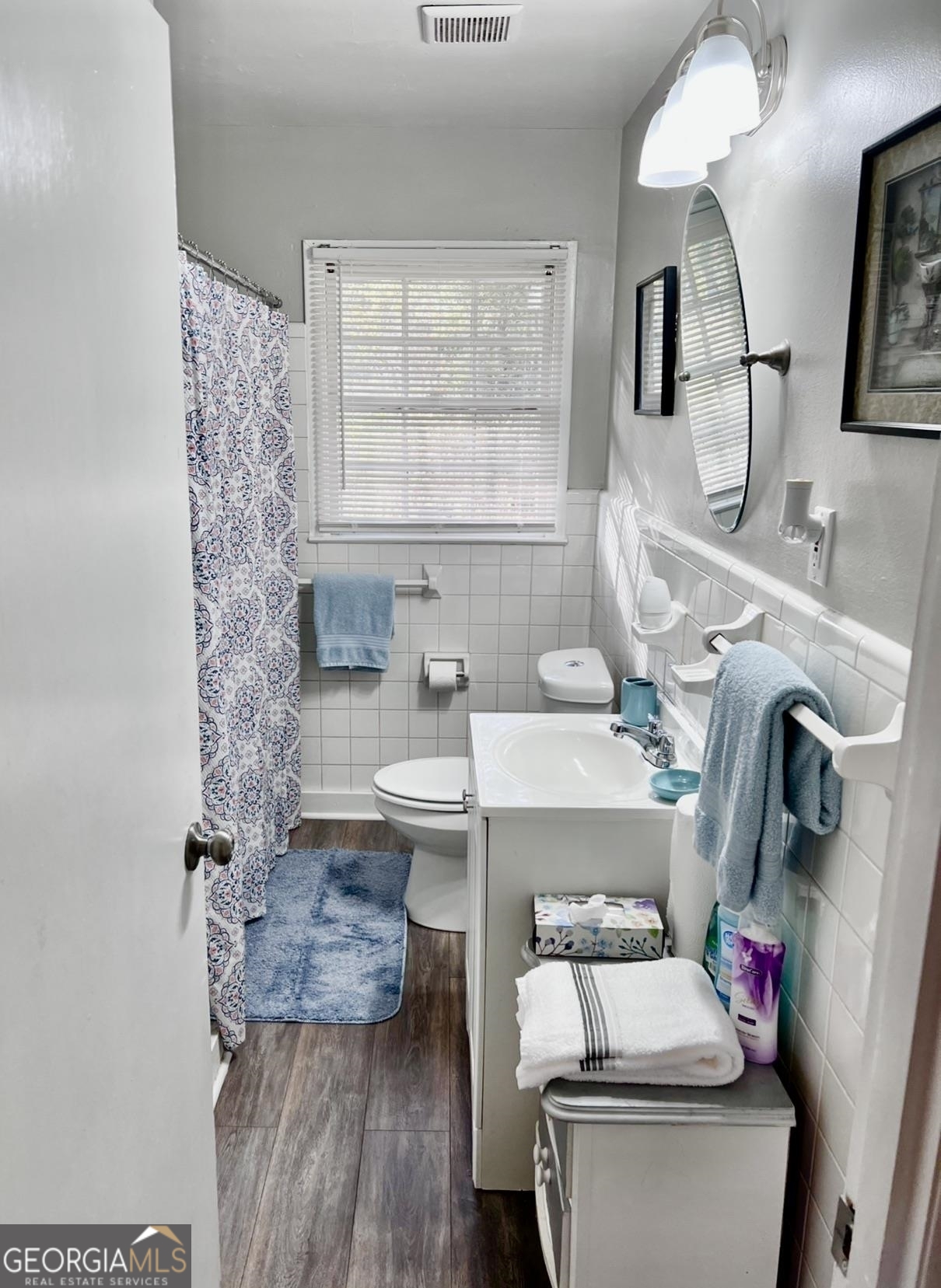 1286 Oak Hill Road Covington, GA 30016 - Photo 9 of 10 a bathroom with a sink toilet and window