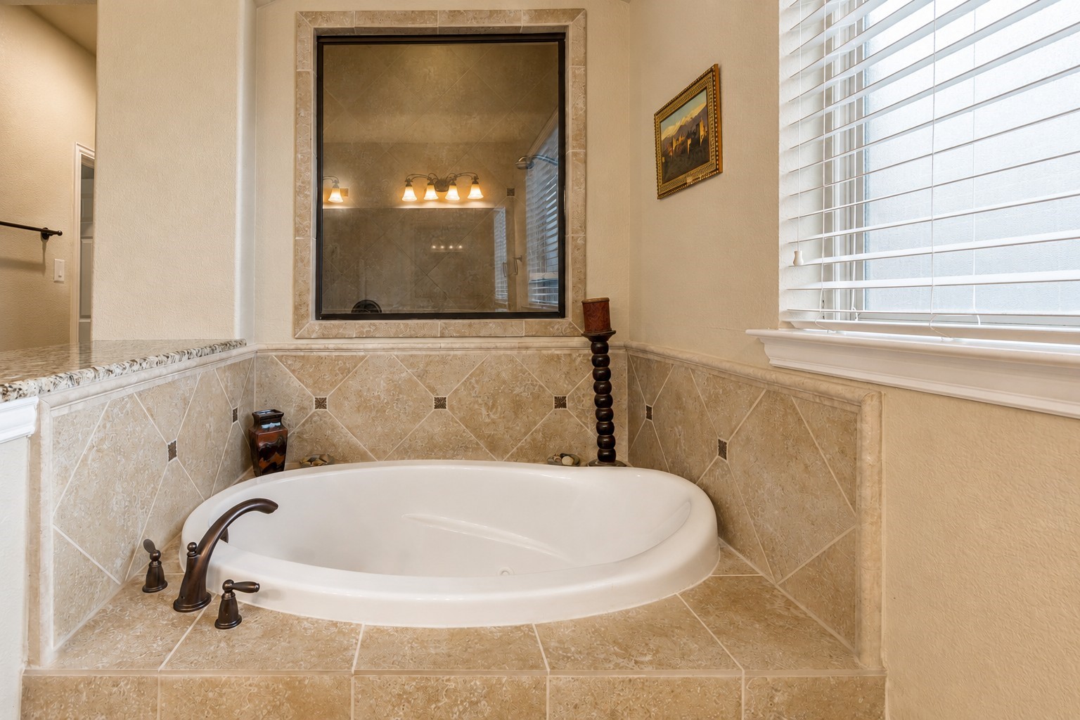 2326 Hamilton Pool Lane Friendswood, TX 77546 - Photo 23 of 49 a bathroom with a bathtub