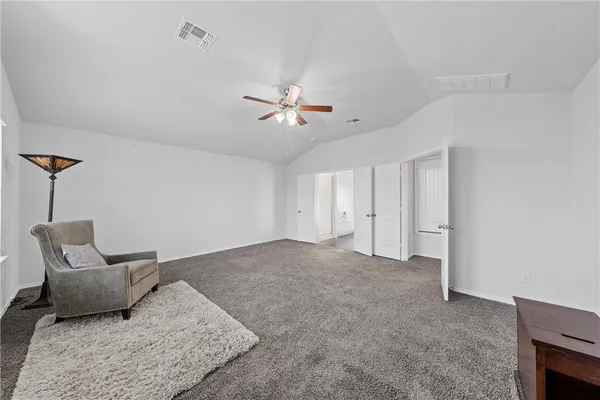 a spacious bathroom with a double vanity sink and a mirror