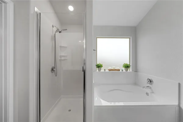 a bathroom with a bathtub and a sink