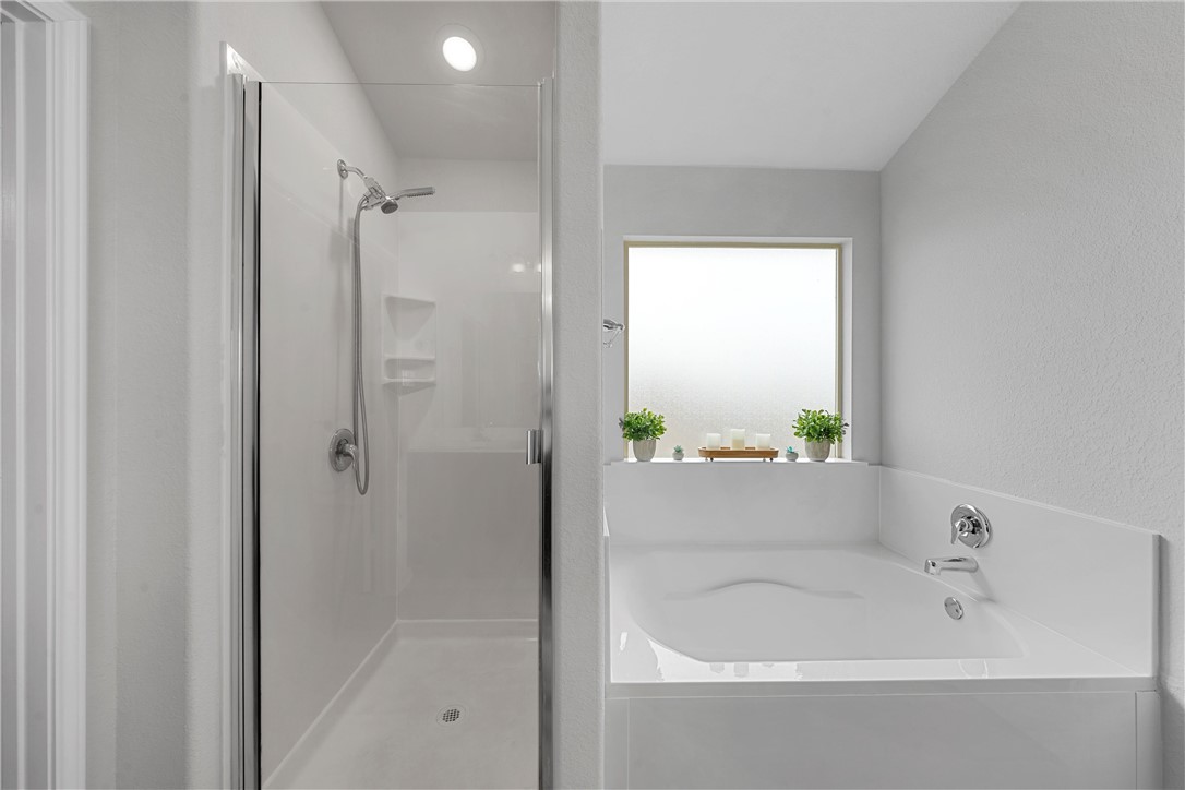 11208 Echo Drive Waco, TX 76708 - Photo 21 of 34 a bathroom with a bathtub and a shower
