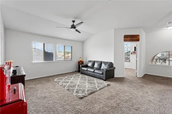 a living room with furniture and a window