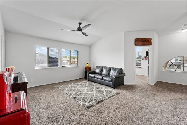 a living room with furniture and a window