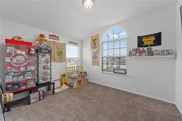 a living room with furniture a window and a couch