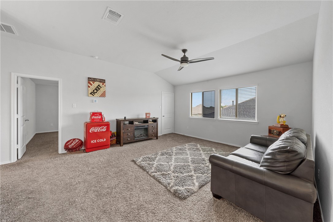 11208 Echo Drive Waco, TX 76708 - Photo 25 of 34 a living room with furniture a window and a couch