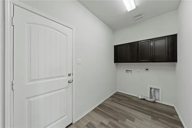 a view of hallway with wooden floor and tv