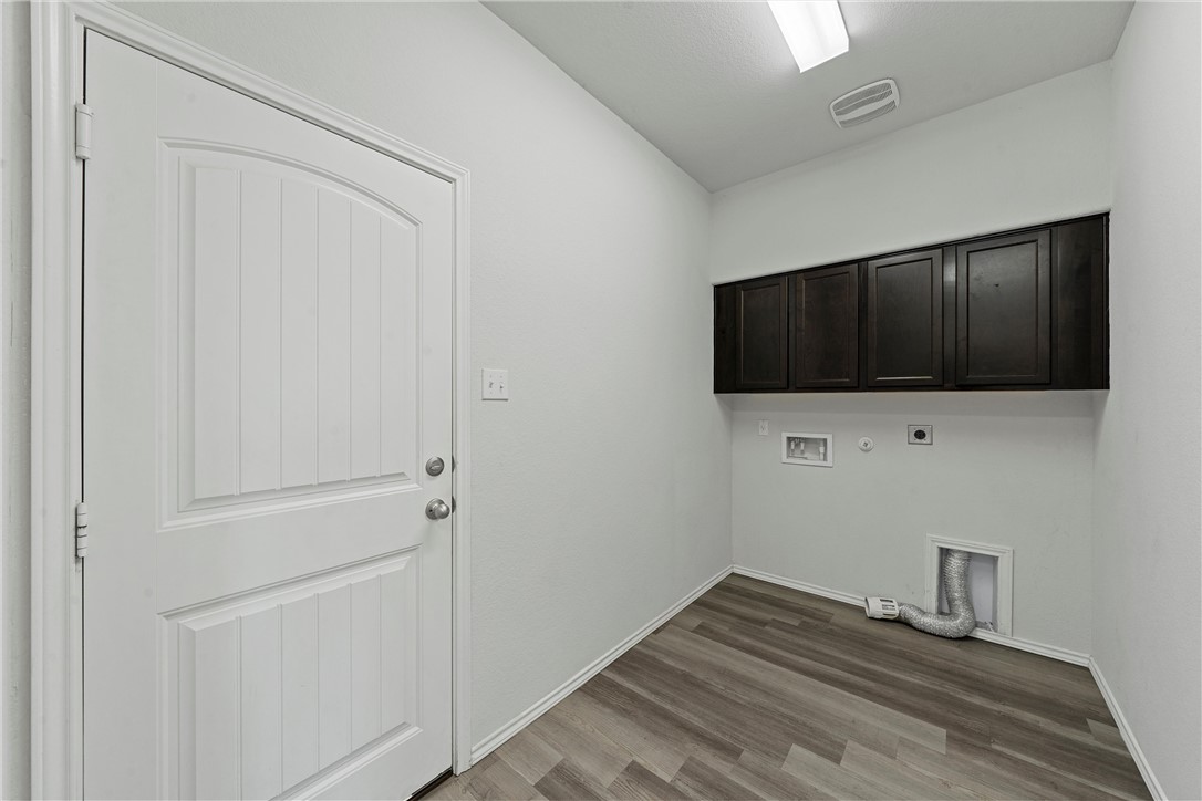11208 Echo Drive Waco, TX 76708 - Photo 8 of 34 a view of hallway with wooden floor and tv