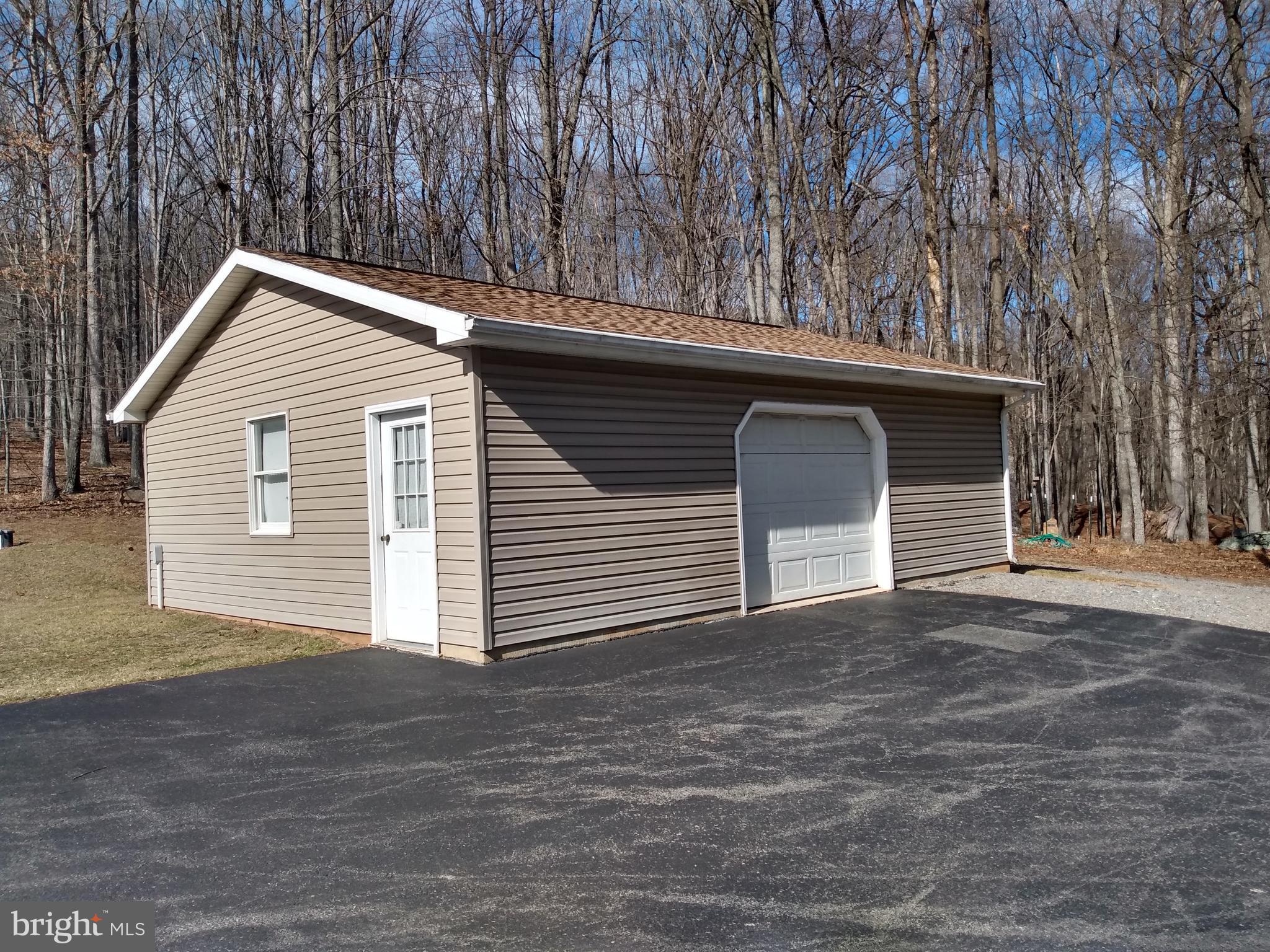 4475 Milo School Road Great Cacapon, WV 25422 - Photo 4 of 63 a house with a outdoor space
