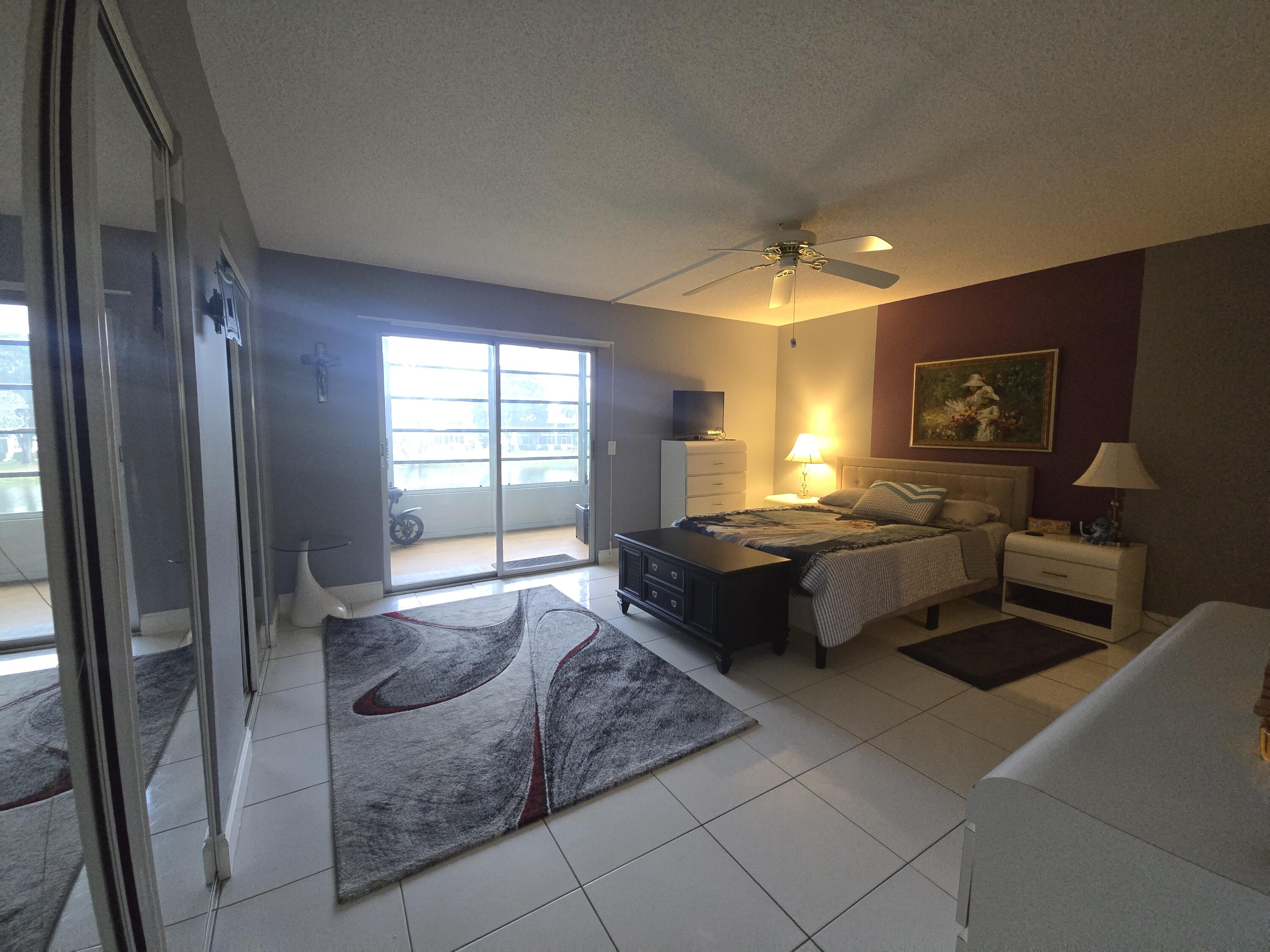 2010 Westbury F, Unit 2010 Deerfield Beach, FL 33442 - Photo 20 of 28 a lobby with furniture and window