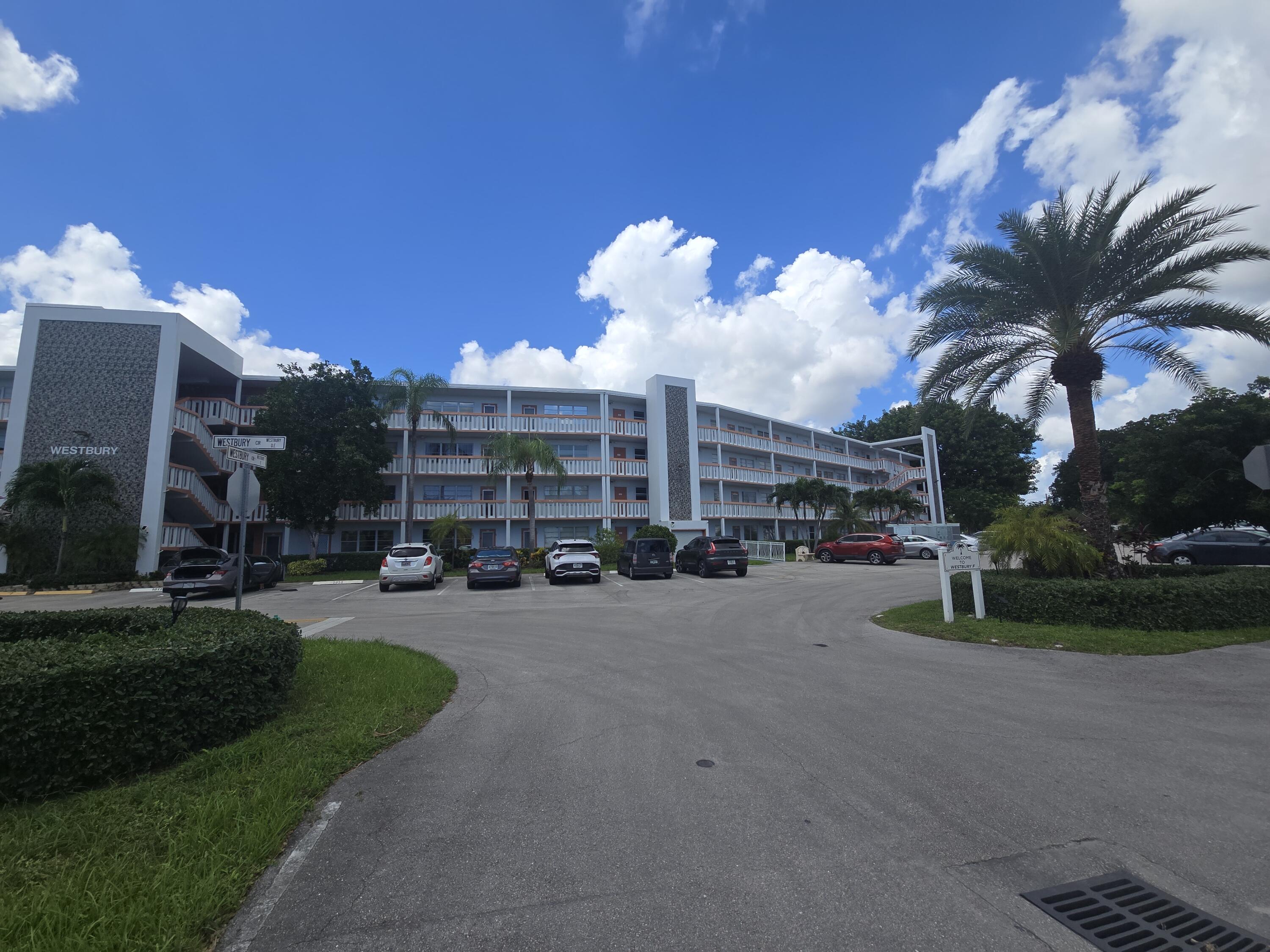 2010 Westbury F, Unit 2010 Deerfield Beach, FL 33442 - Photo 2 of 28 a view of a street with a building in the background