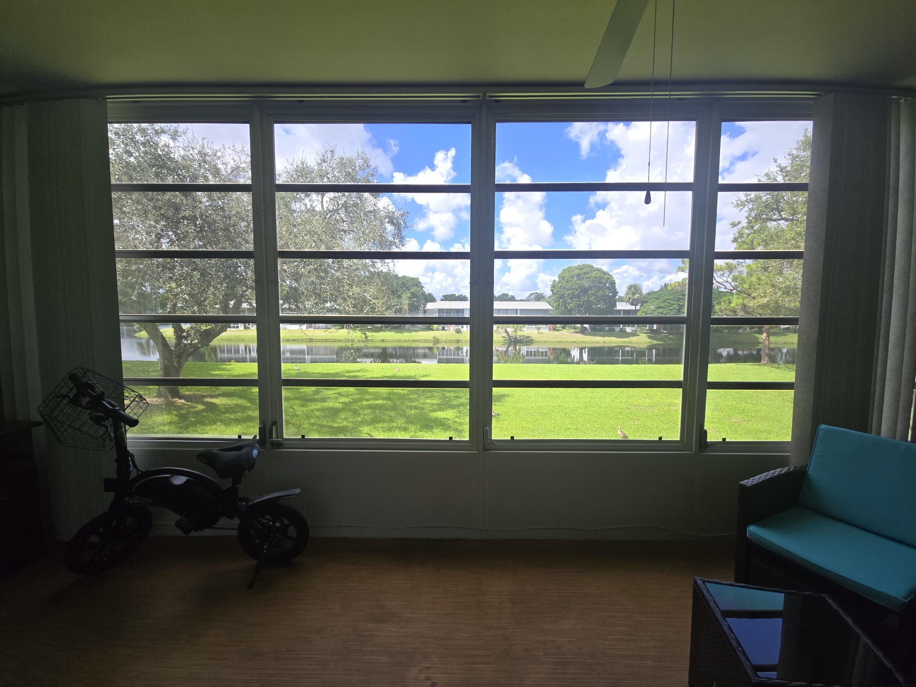 2010 Westbury F, Unit 2010 Deerfield Beach, FL 33442 - Photo 27 of 28 a room with pool table and windows