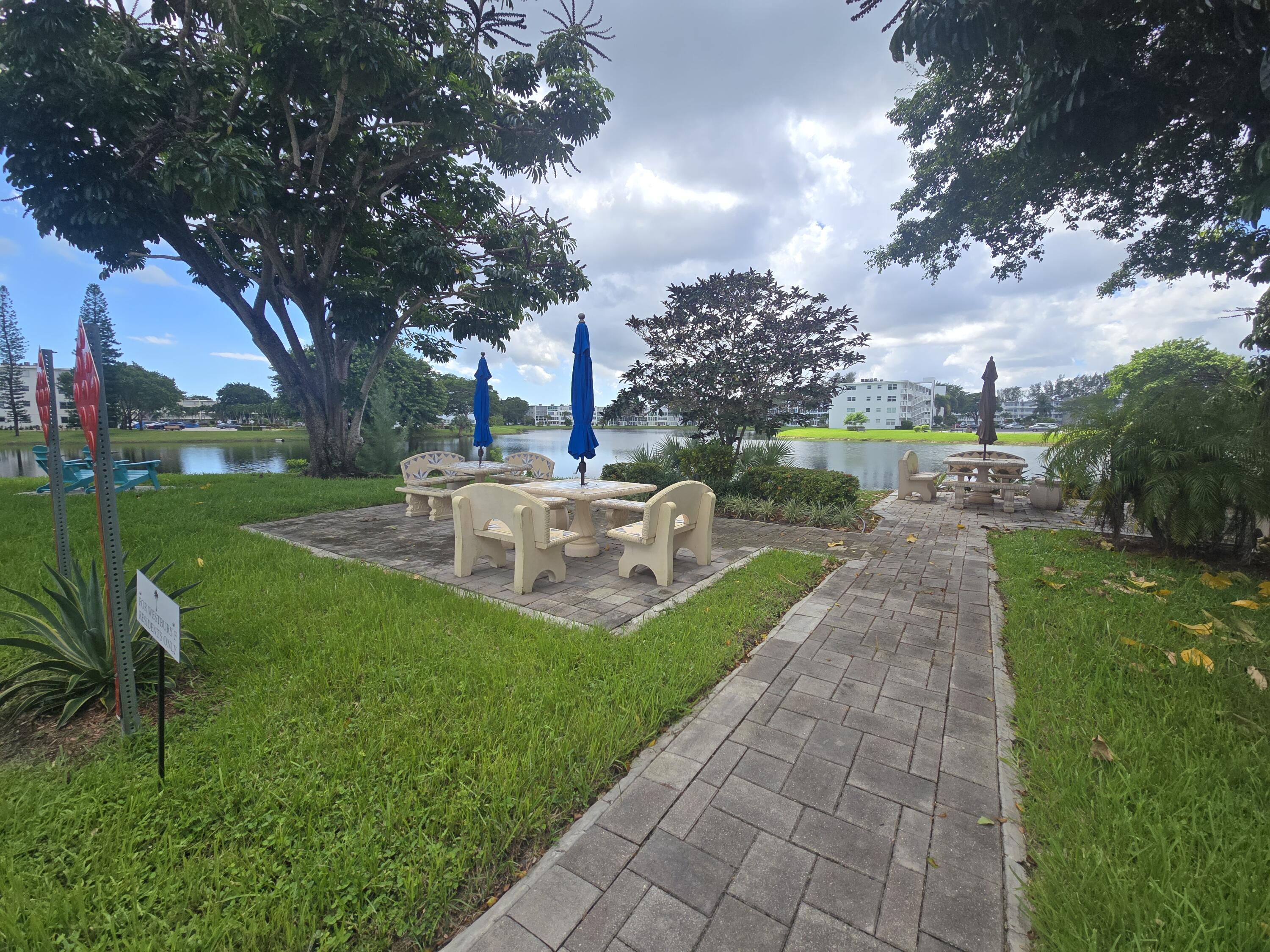 2010 Westbury F, Unit 2010 Deerfield Beach, FL 33442 - Photo 3 of 28 a view of a garden with houses