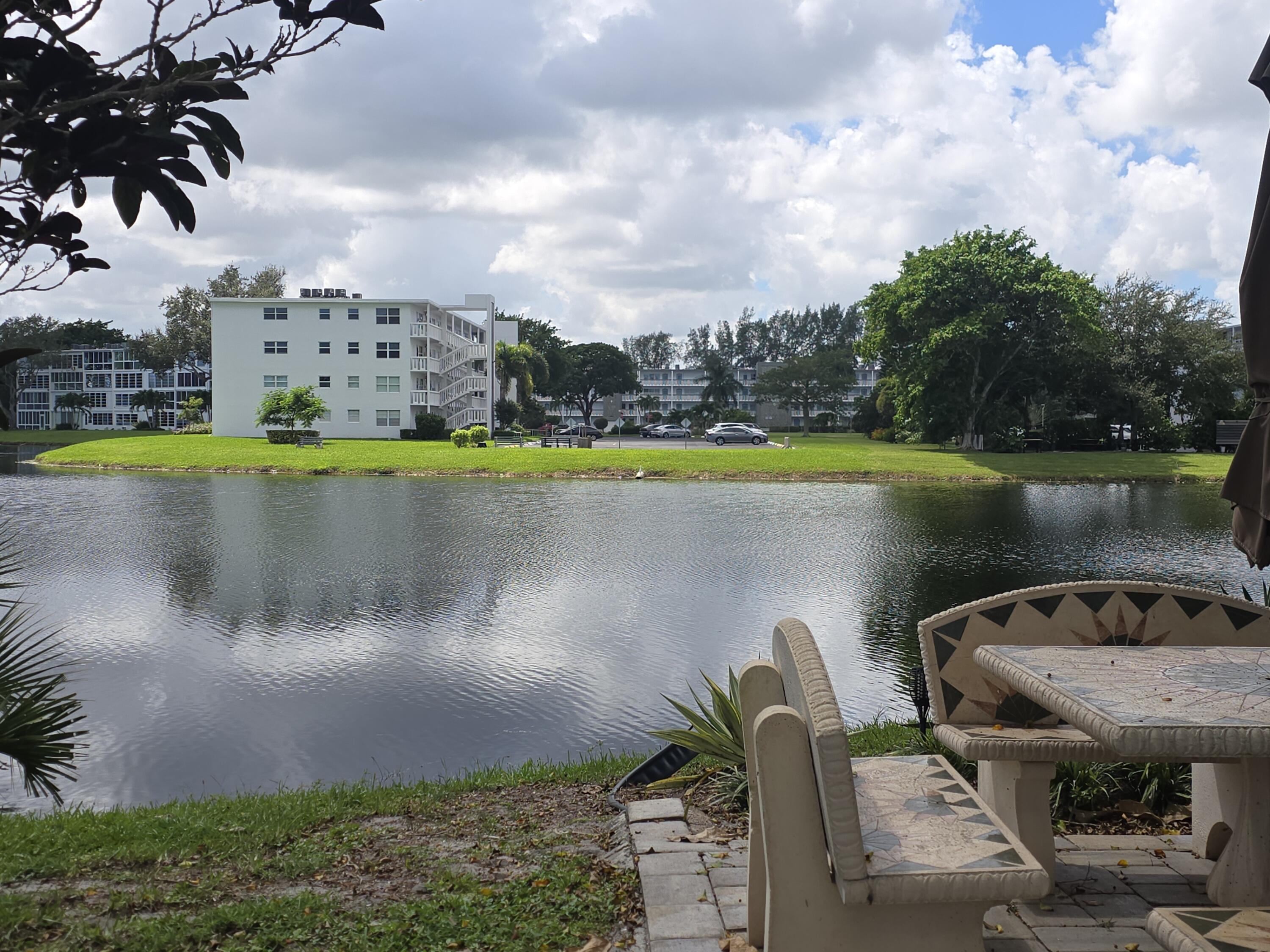 2010 Westbury F, Unit 2010 Deerfield Beach, FL 33442 - Photo 5 of 28 a view of a lake with a terrace