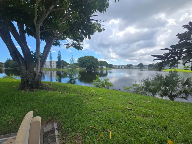 a view of a lake with a yard