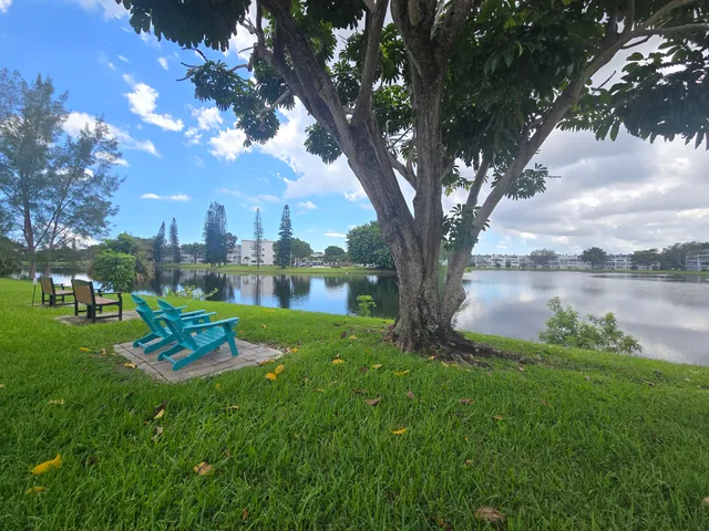 a view of a lake with a yard