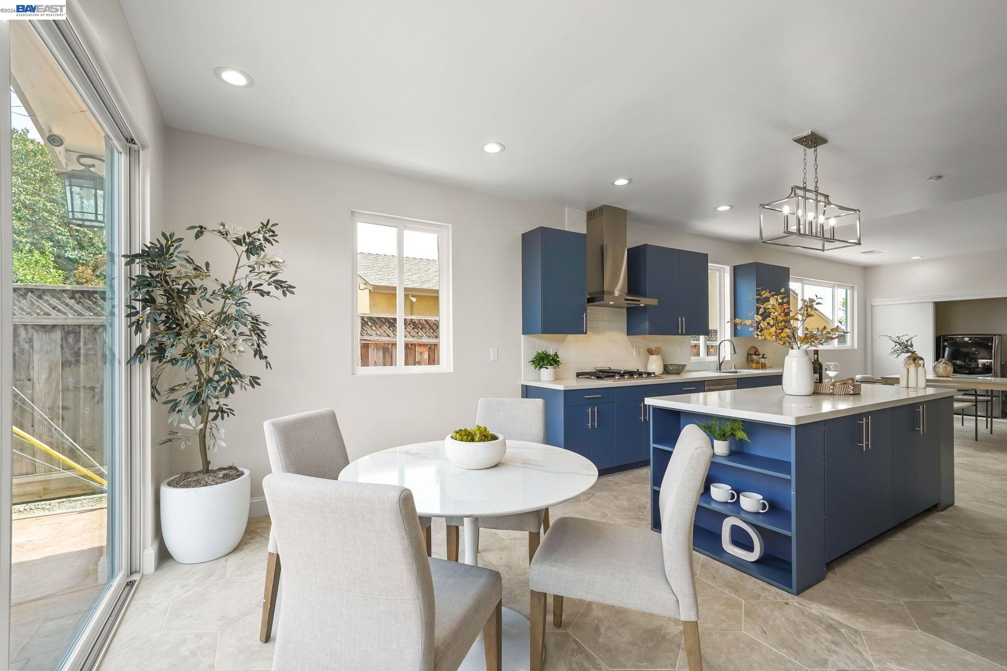 40772 Blacow Road Fremont, CA 94538 - Photo 18 of 40 a kitchen with kitchen island a dining table chairs and sink