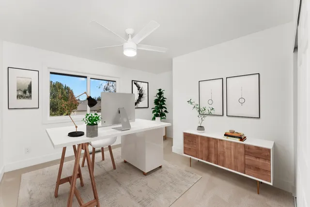 a workspace with furniture and window