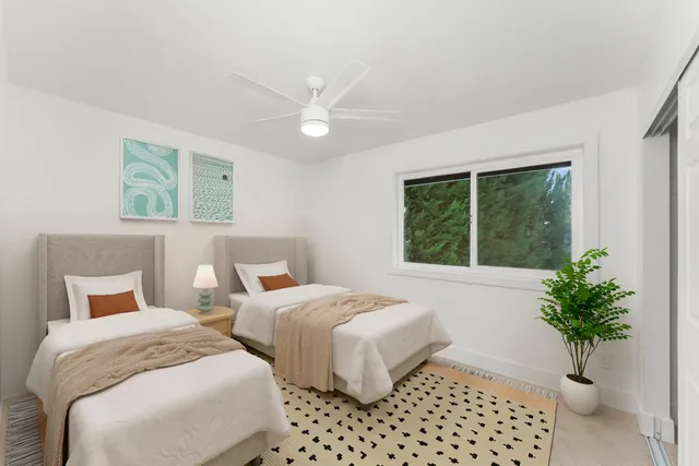 a bedroom with bed and a window